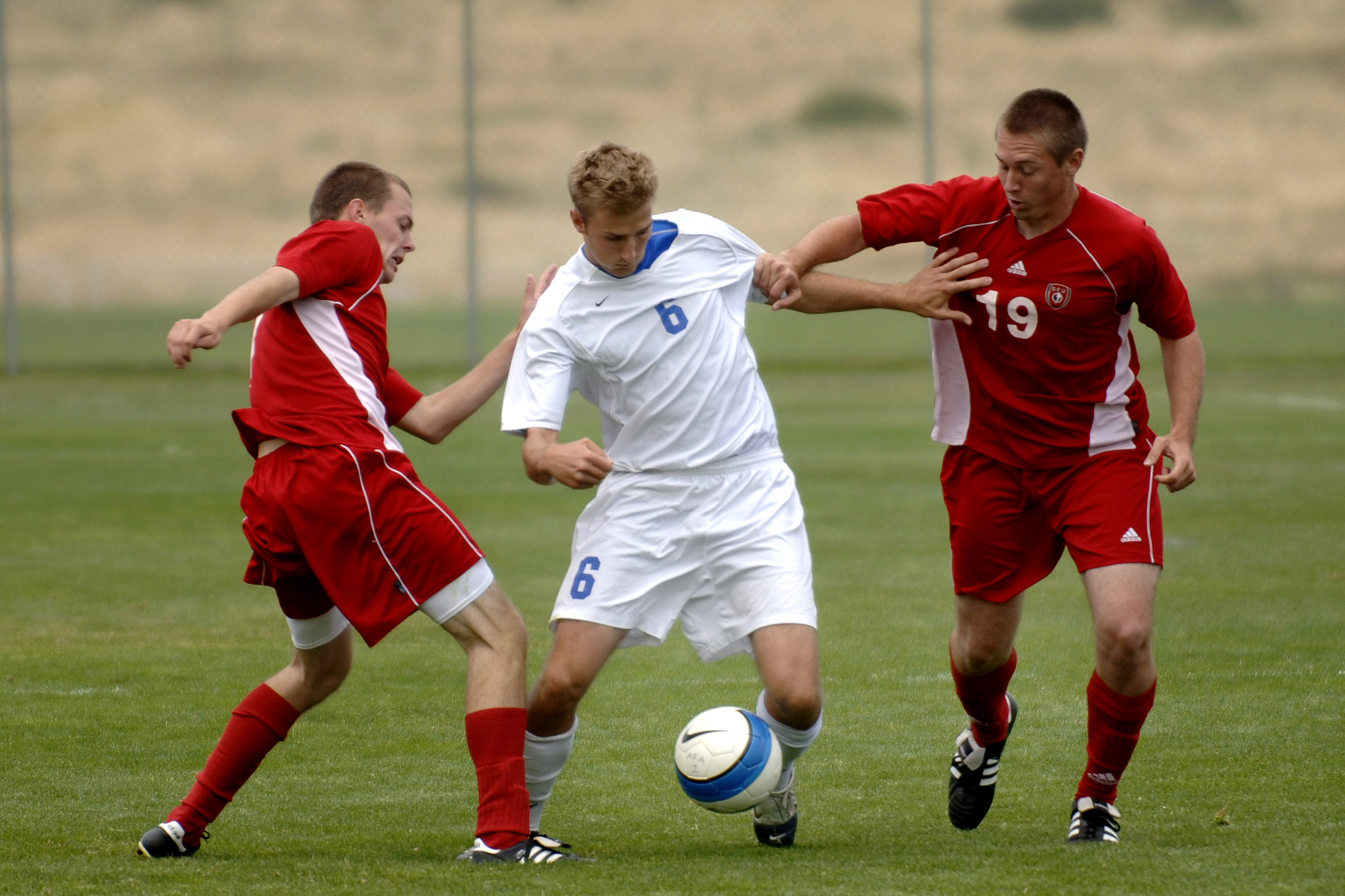 boys playing football